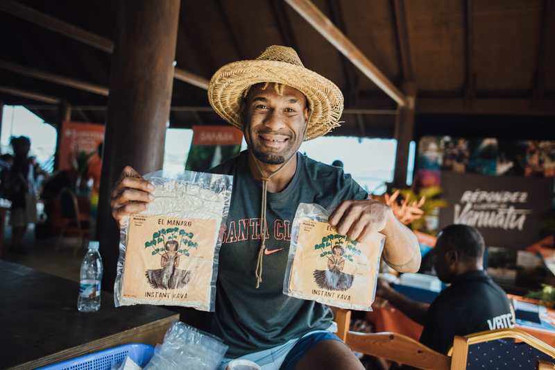 Ni-vanuatu man smiling while holding kava powder, El Manaro booth, Mi Tumoro Vanuatu Travel Expo 2021, Sea Front, Port-Vila town, Efate island, Shefa Province, Vanuatu. Photo: Vanuatu Tourism Office