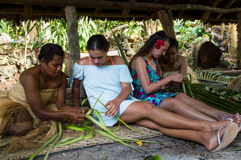 Female tourists learning to weave, Ekasup Cultural Village, Erakor Road, Port Vila, Efate island, Shefa Province, Vanuatu. Photo: Vanuatu Tourism Office